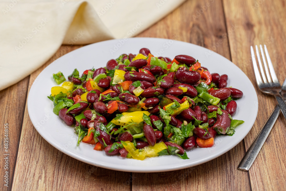 Mexican Bean Salad. Homemade black bean served in a ceramic plate, selective focus Mexican Bean Salad. Homemade black bean served in a ceramic plate, selective focus