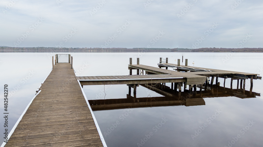 wooden pontoon coast beach aside Leon lake water in southwest france wooden pontoon coast beach aside Leon lake water in southwest france