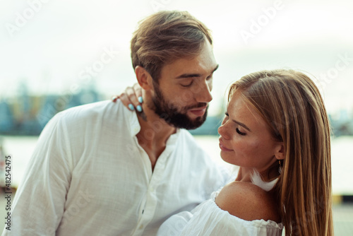 Romantic concept. Man wants to kiss his woman outdoors