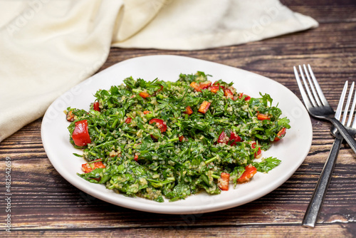 Raw ingredients cooking salad tabouli horizontal view. Healthy food
