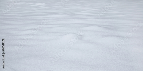 Natural winter background with snow drifts