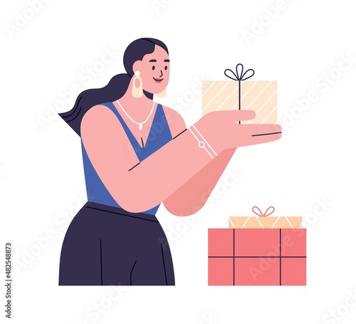 Happy woman with holiday gift box in hands. Person preparing presents and sur...