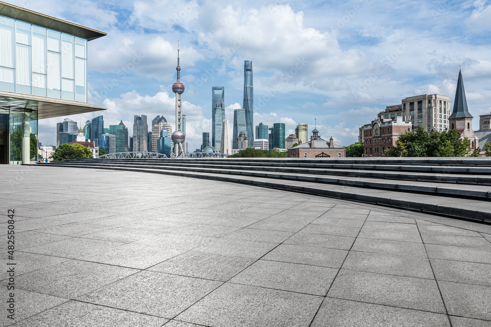 Panoramic skyline and modern commercial buildings with empty square floor in Shanghai, China. empty road and cityscape.