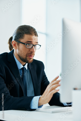 business man wearing glasses work desk computer office manager