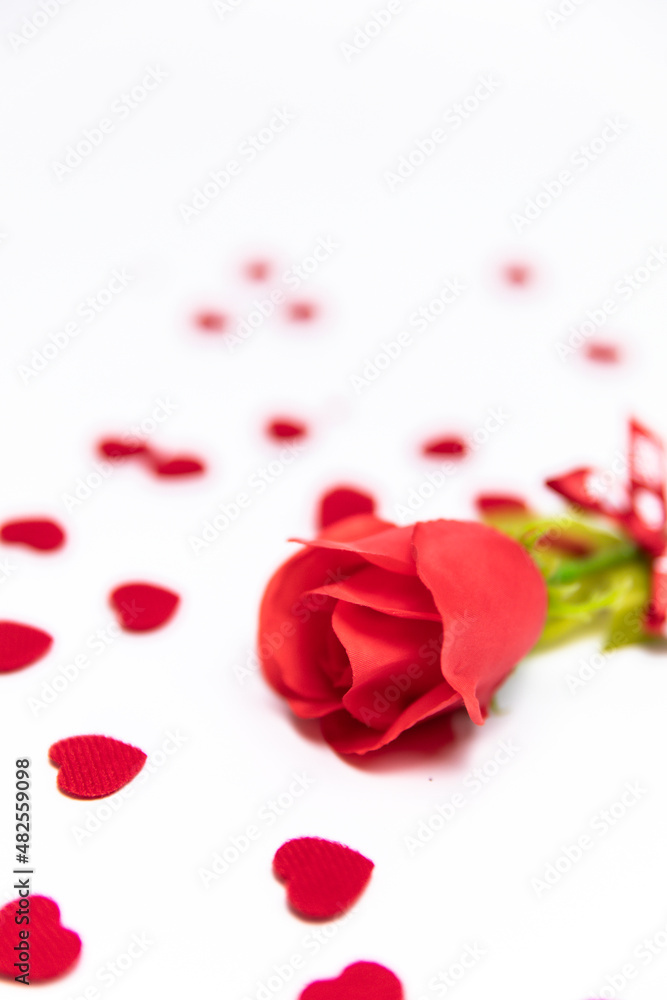 red rose and fabric heart isolated on white. concept of valentine's day. red rose and fabric heart isolated on white. concept of valentine's day.