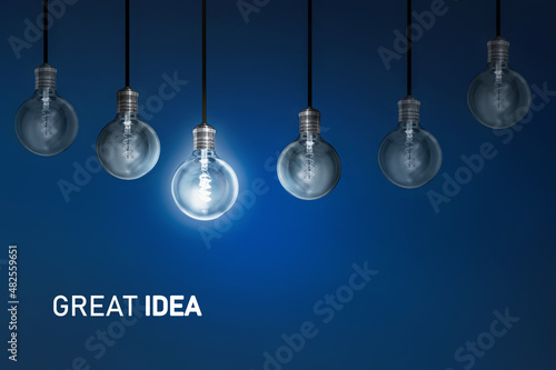 Great idea  ,  bulbs electric and a light as a concept of the new business ideas blue	