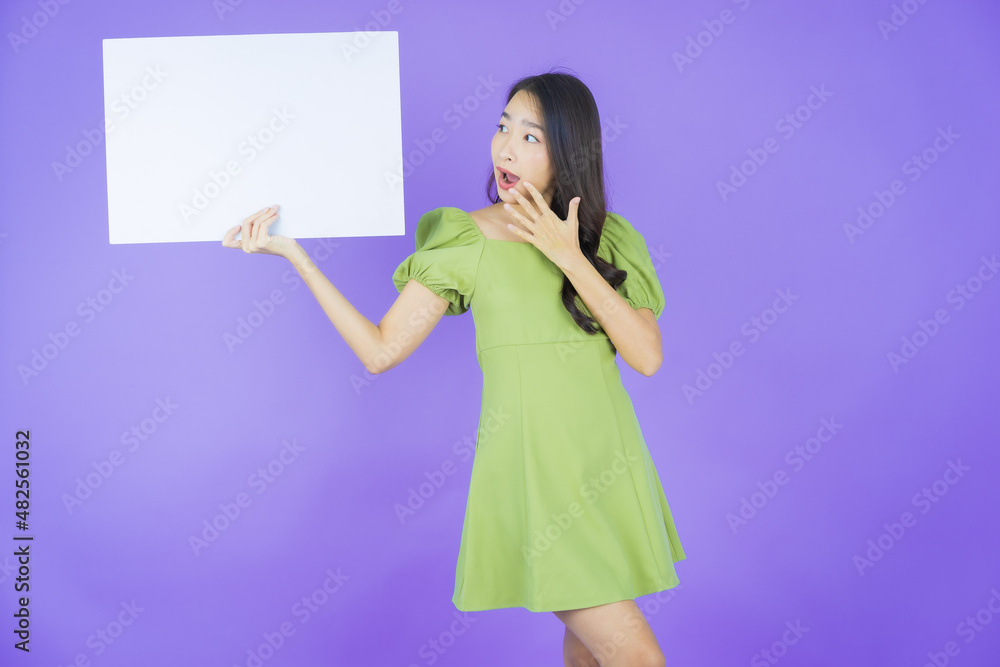 Portrait beautiful young asian woman with empty white billboard Portrait beautiful young asian woman with empty white billboard
