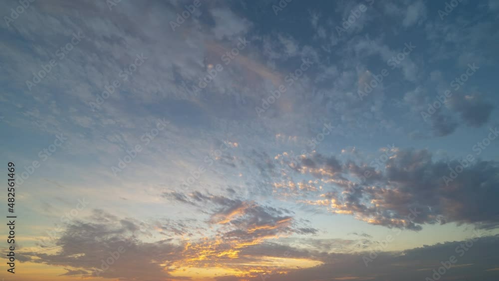 Time lapse of sunset sky. Abstract nature background. Dramatic blue with orange colorful clouds in twilight time. Time lapse of sunset sky. Abstract nature background. Dramatic blue with orange colorful clouds in twilight time.