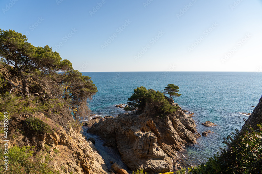 Seascape with calm waves and clear blue sky, spanish coast of costa brava