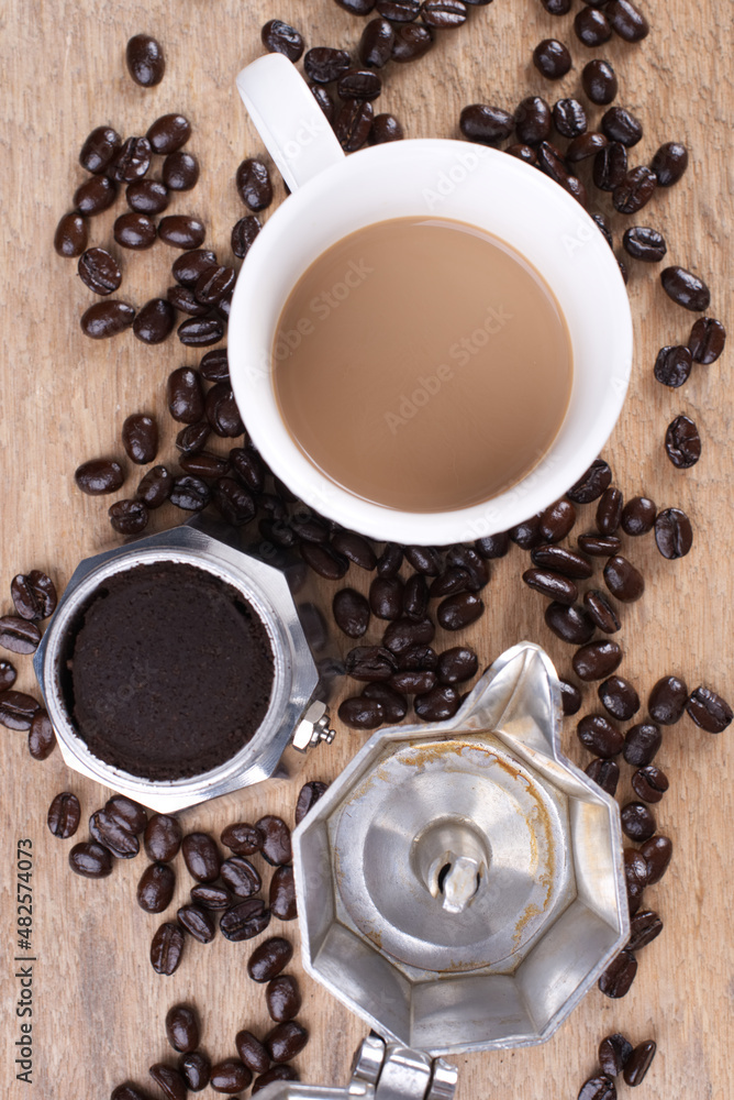 Coffee Latte with moka pot and roasted coffee beans Coffee Latte with moka pot and roasted coffee beans