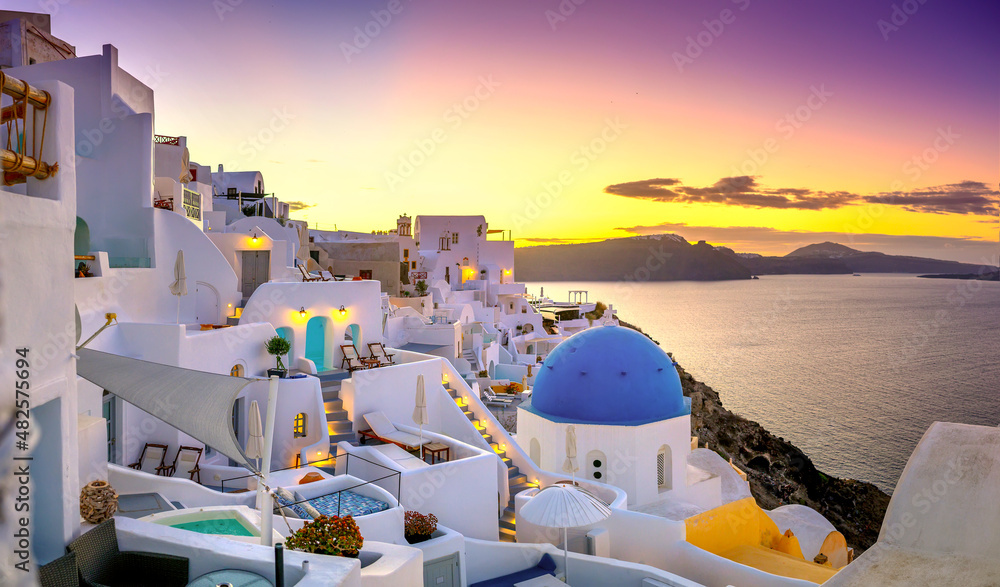 Picturesque sunrise on famous view resort over Oia town on Santorini island, Greece, Europe. famous travel landscape. Summer holidays. Travel concept background.