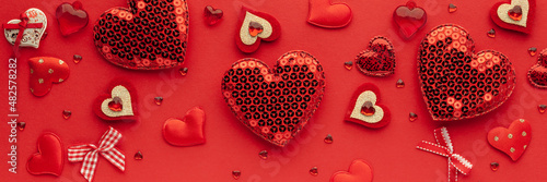 Valentine's day or Wedding romantic concept. Red hearts on red background.Top view, flat lay, copy space.