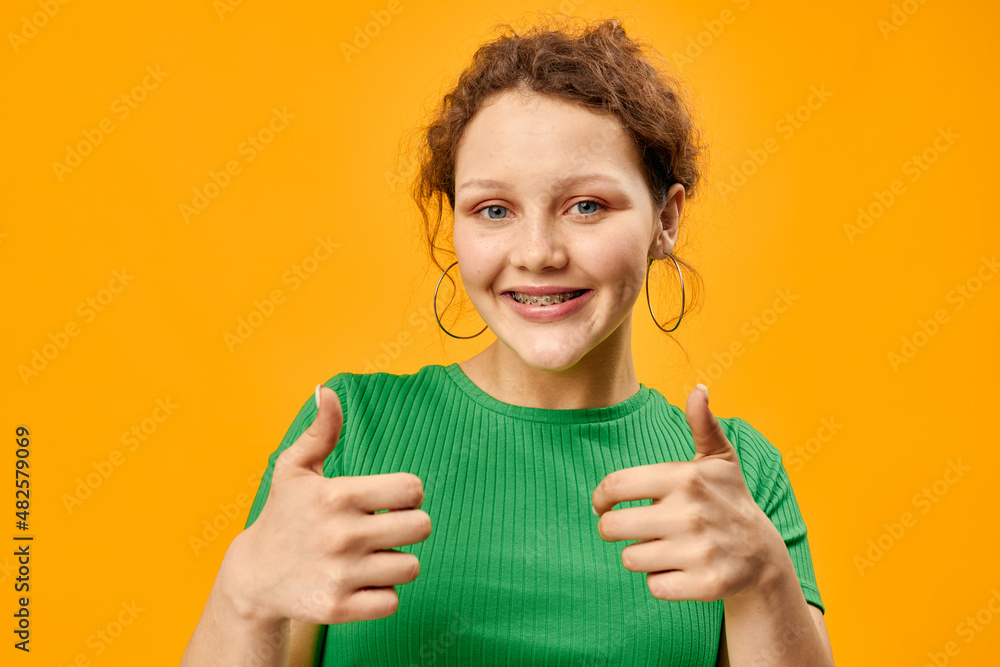 smiling woman in green t-shirt posing cropped view smiling woman in green t-shirt posing cropped view