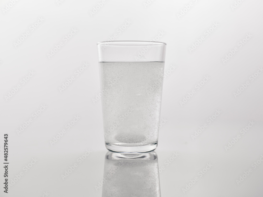 a medicine dissolved in a glass of water a medicine dissolved in a glass of water