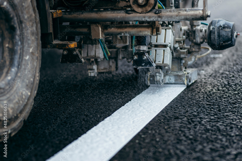 Applying new road markings, outside the city