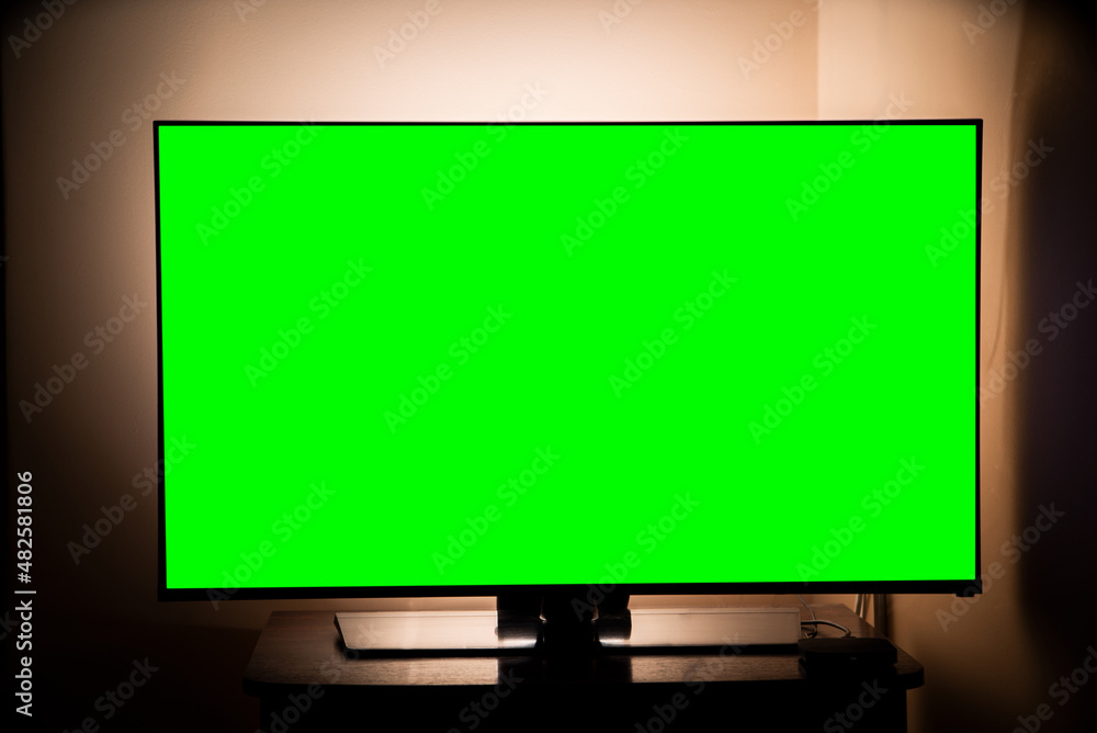 green screen tv in a dark room. Watching movies and TV series. online services. green screen tv in a dark room. Watching movies and TV series. online services.