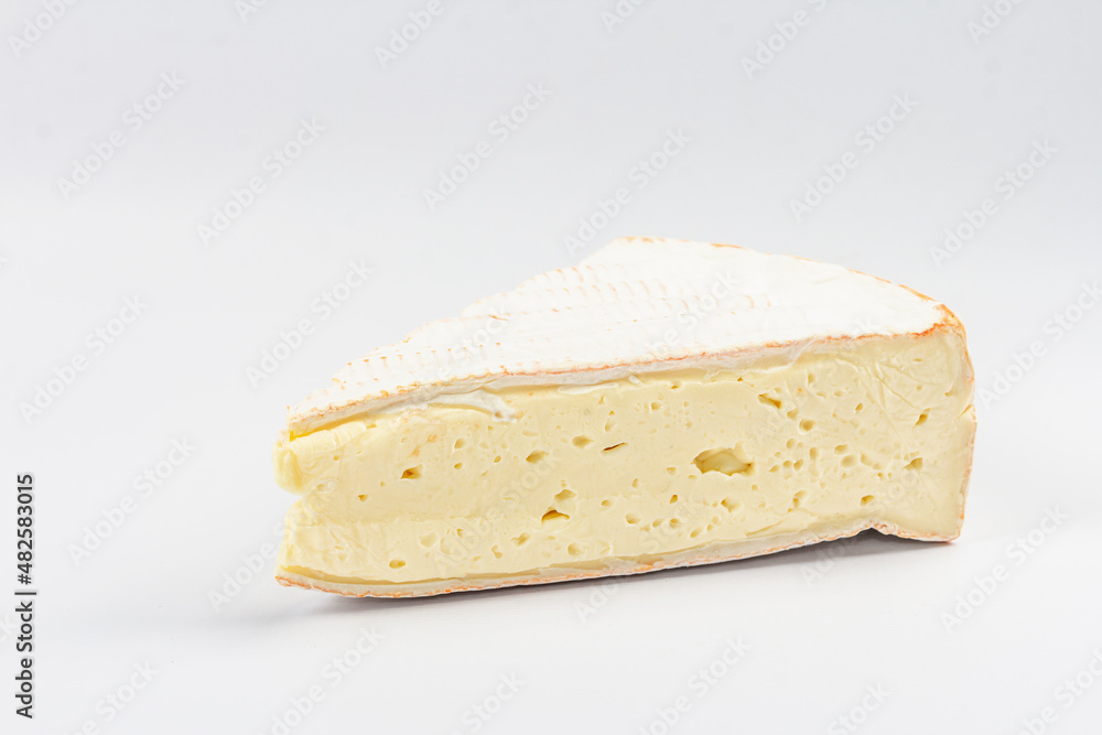 Rougette cheese isolated on white background. Soft-ripened red rind cheese