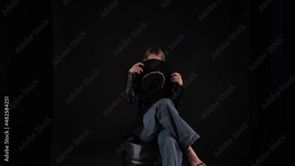 Model posing on black background Model posing on black background
