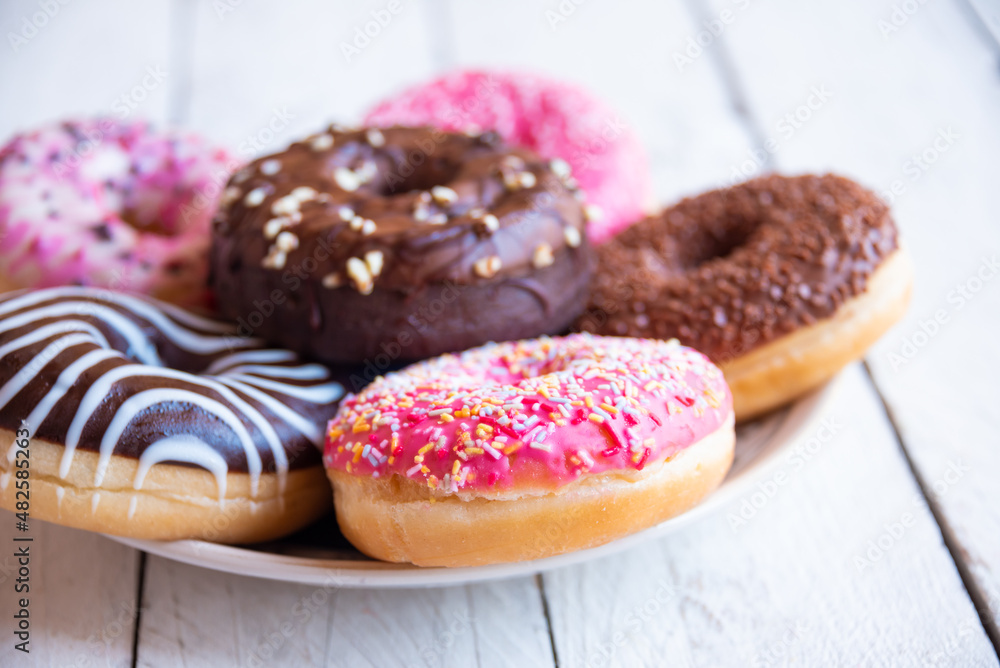 Bright pink donuts, sweet delicious baked dessert
