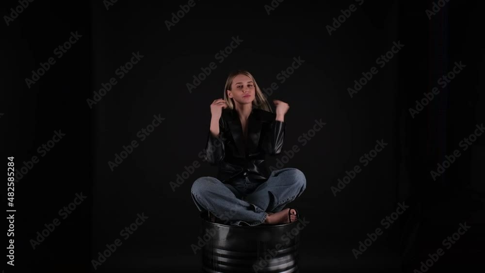 girl sitting on a chair dancing girl sitting on a chair dancing