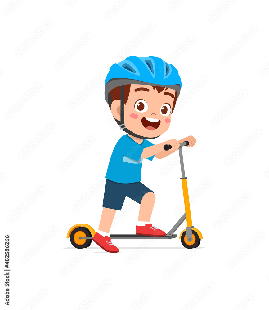 cute little boy riding scooter and wear helmet