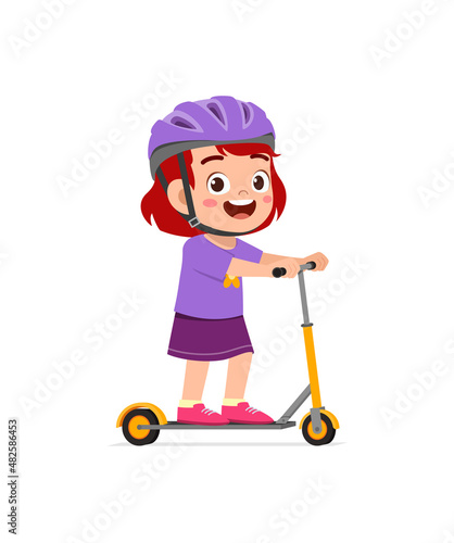 cute little girl riding scooter and wear helmet