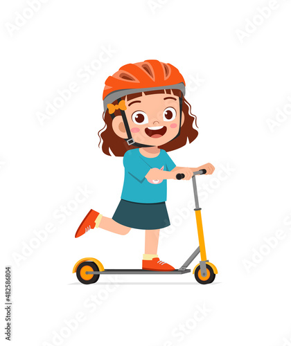 cute little girl riding scooter and wear helmet