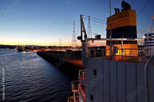 Twilights and night views of cargo terminal and pier for loading bulk cargo of cooper concentrates by shore facilities. Port of Vancouver, WA, USA. August,2020.