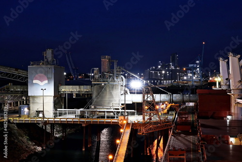 Twilights and night views of cargo terminal and pier for loading bulk cargo of cooper concentrates by shore facilities. Port of Vancouver, WA, USA. August,2020.