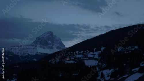 4k Aerial footage drone view of Little town with snow in Trento Trentino Italy by night, evening, sunset