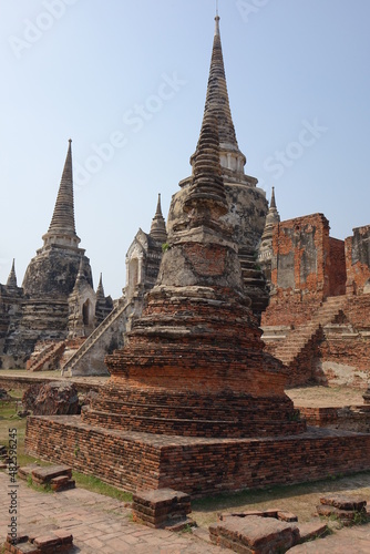Adventure of exploring the ruins of red brick Wat Phra Si Sanphet temple  vertical image   Ayutthaya  Thailand
