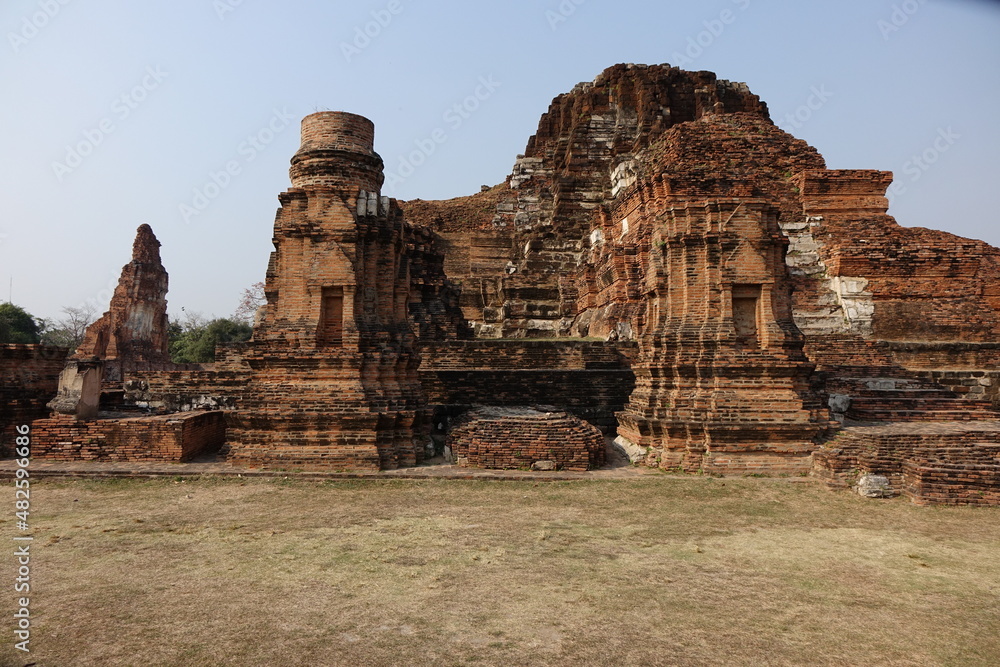 Adventure of exploring the ruins of red brick Wat Mahathat temple (horizontal image), Ayutthaya, Thailand