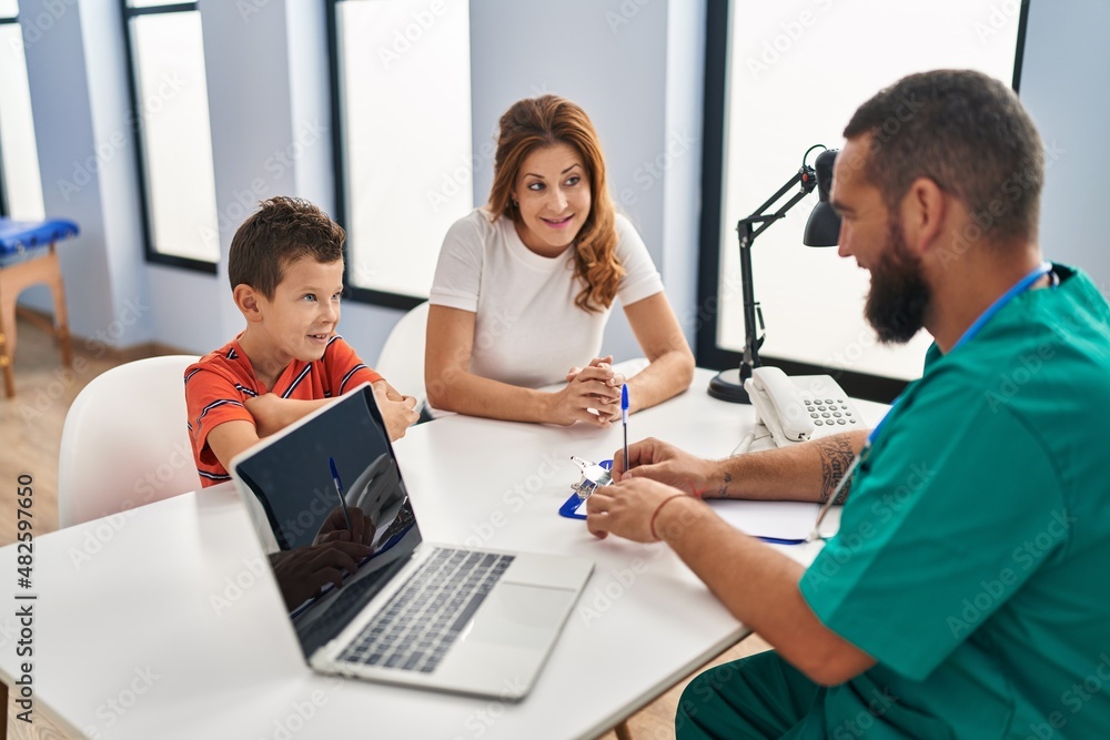 Family having medical consultation at clinic Family having medical consultation at clinic