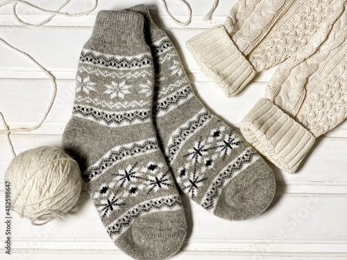 New year flat lay layouts. Knitted socks with a pattern
