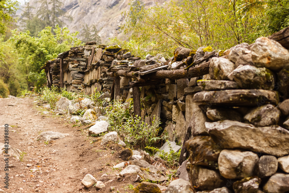 Prayer stone wall on the road in the Himalayas Prayer stone wall on the road in the Himalayas