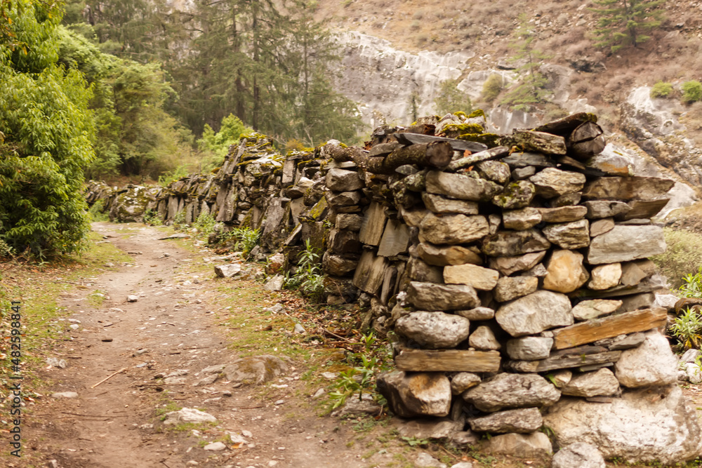 Prayer stone wall on the road in the Himalayas