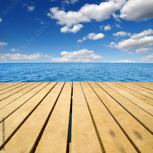Fototapeta Naklejka Na Ścianę i Meble -  Wood and blue sea
