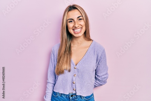 Beautiful hispanic woman wearing casual shirt with a happy and cool smile on face. lucky person. © Krakenimages.com