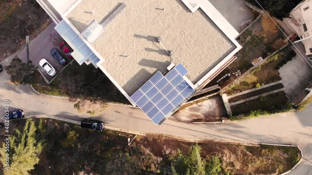 Panels of small solar power plant mounted on the house. Alternative energy sources. Ecological production of electricity without environment pollution Panels of small solar power plant mounted on the house. Alternative energy sources. Ecological production of electricity without environment pollution