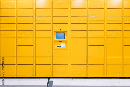 Yellow locker with screen and scanner for storage of packages purchased online. Messaging concept, compare online, e-commerce and packages