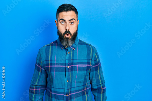 Young hispanic man wearing casual clothes afraid and shocked with surprise expression, fear and excited face. © Krakenimages.com
