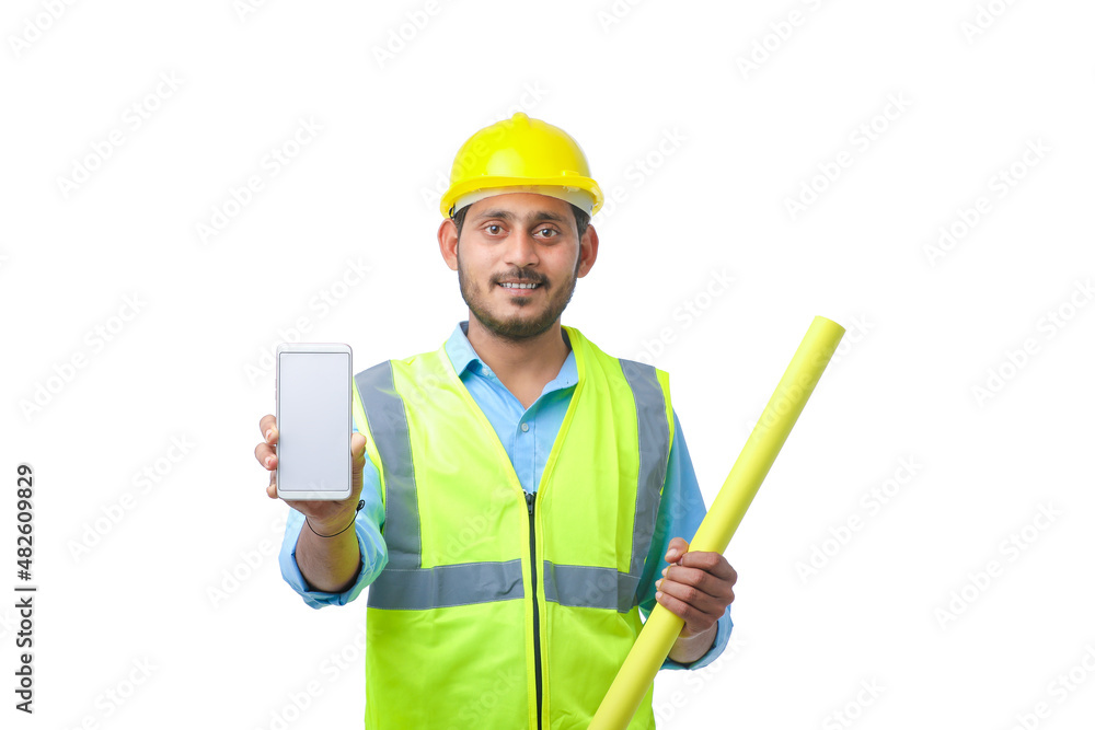 Young engineer showing smartphone screen on white background. Young engineer showing smartphone screen on white background.