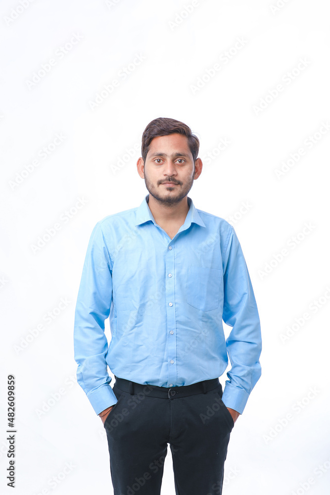Young indian man standing on white background. Young indian man standing on white background.