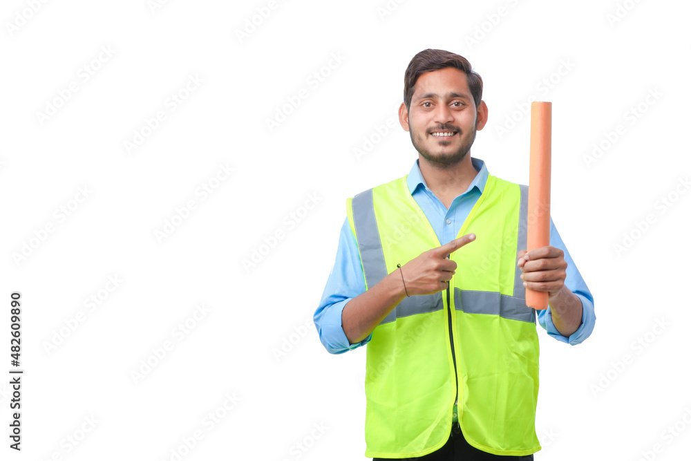 Young architect man with helmet and holding blueprints in hand. on white background. Young architect man with helmet and holding blueprints in hand. on white background.