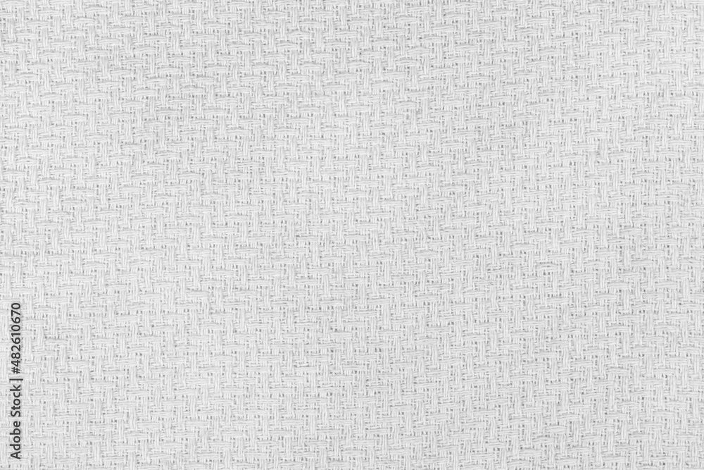 White natural texture of knitted wool textile material background. White crochet cotton fabric woven canvas texture. close up White natural texture of knitted wool textile material background. White crochet cotton fabric woven canvas texture. close up