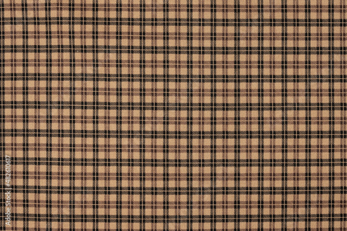 Brown natural texture of textile material with checkered pattern