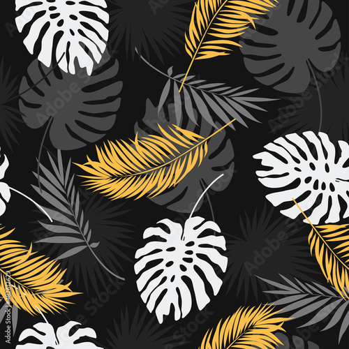 Exotic botanical background design. Vector seamless pattern with gold and black tropical leaves on a dark background.