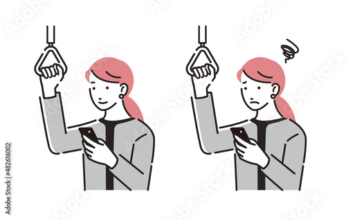 電車の中でスマホを見るビジネスパーソン女性