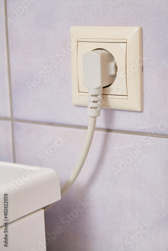 Electrical plug in socket close-up © glebchik