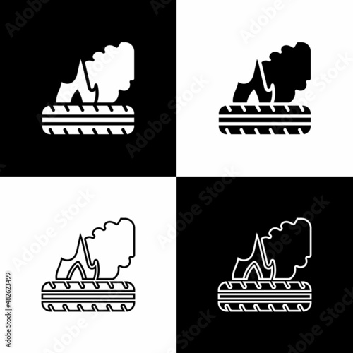 Set Lying burning tires icon isolated on black and white background. Vector